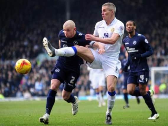 HELLO AGAIN: Steve Morison is challenged by Alan Dunne during the lat meeting with Millwall at Elland Road in February 2015. Leeds won 1-0. Picture: Simon Hulme