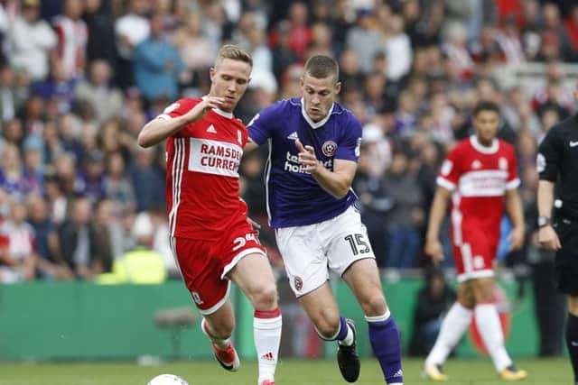Adam Forshaw of Middlesbrough tussles with Paul Coutts of Sheffield Utd during the Championship match at the Riverside Stadium, Middlesbrough. Picture date: August 12th 2017. Picture credit should read: Simon Bellis/Sportimage