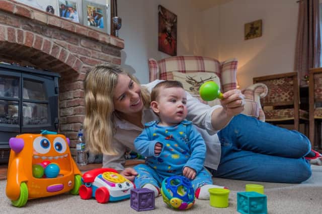 Date: 3rd January 2018.Picture James Hardisty.Andrea Jenkyns, Conservative Member of Parliament for Morley and Outwood, at home in Gildersome, with her baby boy Clifford, aged 9 months.