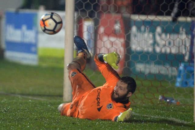 Jonny Maxted saves his first penalty against Accrington Stanley.