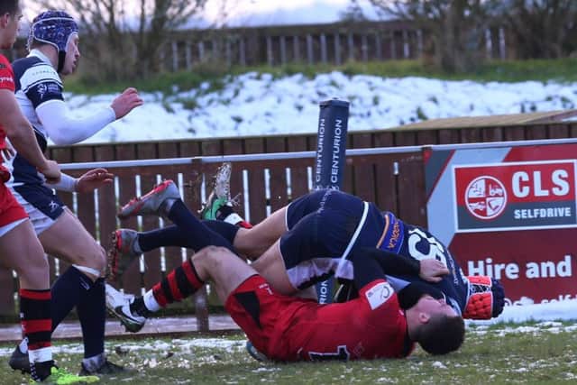 Chris Elder scores Carnegie's opening try against Jersey.