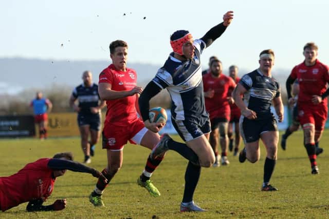 Chris Elder breaks through to score a try against Jersey.