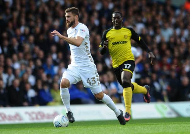 MOVING ON: Leeds United's Mateusz Klich gets away from Burton's Marvin Sordell.