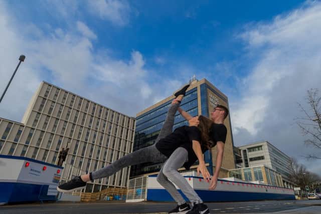 DANCE: Pictured are dance students Tom Scholey and Ciara Clayton, both 21, celebrating the start of the building work on the site. PIC: James Hardisty