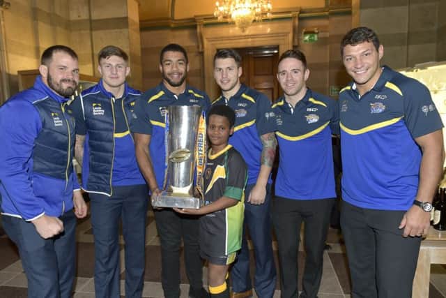 Leeds rhinos  Civic Reception
Daniel fre, 10 of chapeltown Cougars helps out with the Grand Final trophy with players, Adam Cuthbertson, Liam Sutcliffe, Kallum Watkins, Tom Briscoe, Richie Myler and Ryan Hall