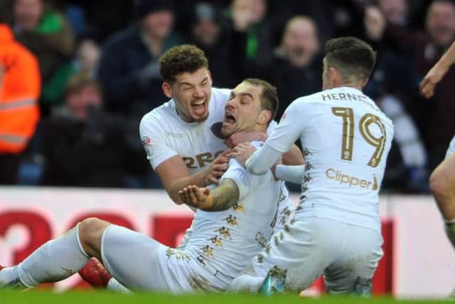 TIMELY REMINDER: Leeds United's Pierre-Michel Lasogga celebrates his second goal against Millwall with Kalvin Phillips and Pablo Hernandez.
 Picture: Tony Johnson.