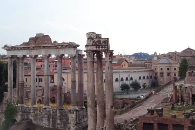 On our way to the Forum in Rome. Of all that the Romans have given the world, it is their language that still speaks most.