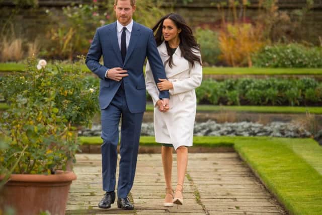 For the official engagement photos, Meghan Markle stepped out in a luxurious white wrap coat by Line, a brand from her most recent adopted home of Canada. The coat sold out within minutes, has already been renamed the Meghan in her honour,  and will be back and available to buy from February. Dominic Lipinski/PA Wire