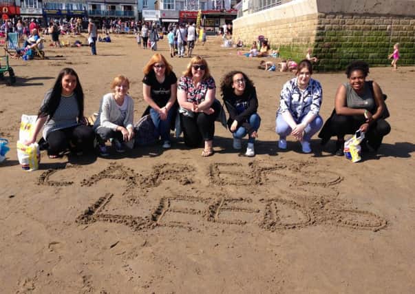 Caring: Carers Leeds staff take young carers from the city on a trip to Scarborough.
