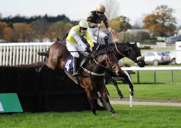 Jockey Sam Twiston-Davies (right), who finished second, is shot from the saddle on Fago as he challenges eventual winner Wakanda and Danny Cook at the final fence in the bet 365 Handicap Chase at Wetherby in October 2015. PIC: John Giles/PA Wire