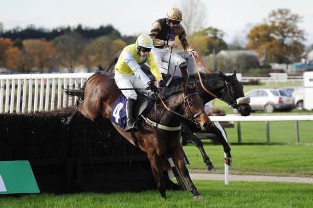 Jockey Sam Twiston-Davies (right), who finished second, is shot from the saddle on Fago as he challenges eventual winner Wakanda and Danny Cook at the final fence in the bet 365 Handicap Chase at Wetherby in October 2015. PIC: John Giles/PA Wire