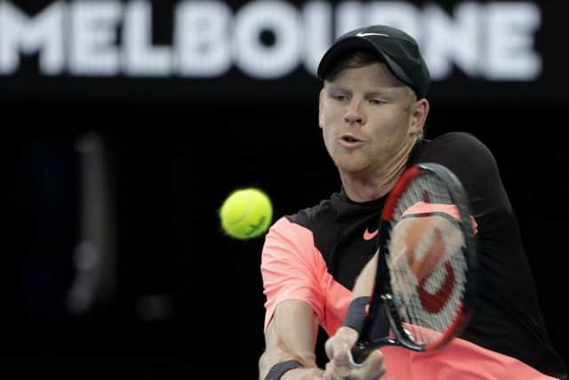 DENIED: Kyle Edmund makes a backhand return to Marin Cilic in their Melbourne semi-final. Picture: AP/Dita Alangkara