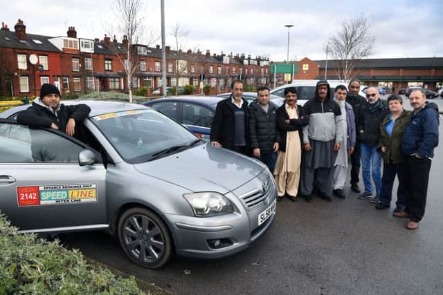 Speedline manager Mohammed Liakat with fellow minicab drivers.