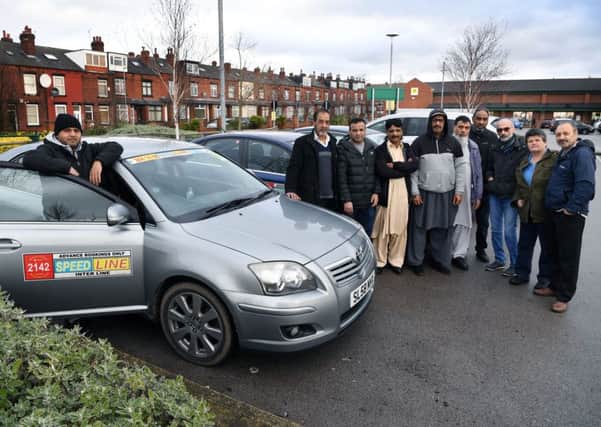 Speedline manager Mohammed Liakat with fellow minicab drivers.
