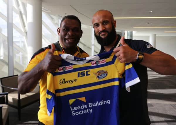 Former Leeds winger Marcus Bai will be at the World Club Challenge next month. He was presented with a 2018 Rhinos shirt by former team-mate Jamie Jones-Buchanan at the World Cup last year.