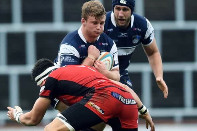 Yorkshire Carnegie man of the match Harry Newborn takes on the Hartpury defence. PIC: Jonathan Gawthorpe