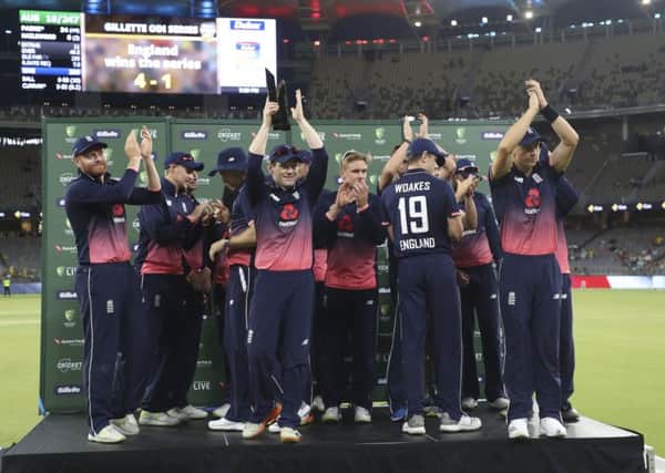 England's captain Eoin Morgan holds up the trophy and celebrates with his players after winning the ODI series against Australia 4-1. Picture: AP/Trevor Collens