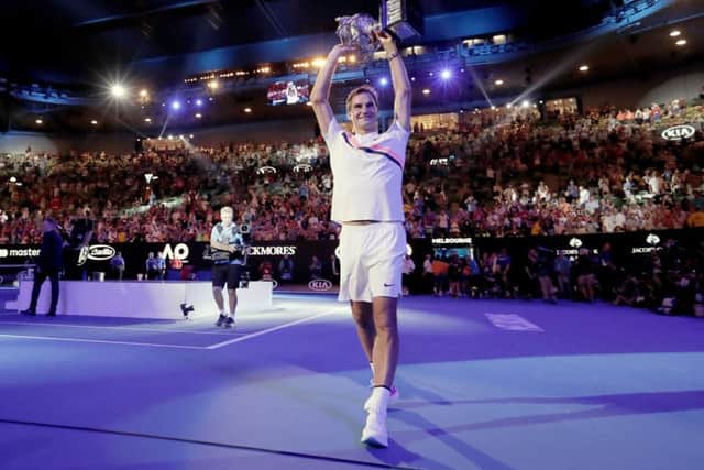 STAR MAN: Switzerland's Roger Federer holds his trophy up after defeating Croatia's Marin Cilic in the men's singles final at the Australian Open. Picture: AP/Vincent Thian