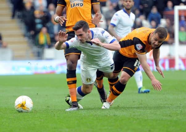 FORMER BATTLE: Leeds' Lewis Cook is challenged by Hull's Shaun Malone back in April 2016. Picture: Simon Hulme