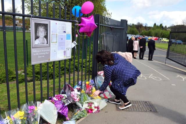 Tributes outside the school