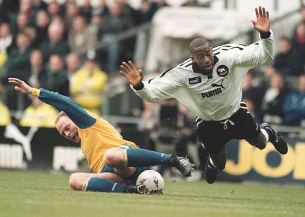 Derby County's Paulo Wanchope (right) is brought down by Robert Molenaar. PIC: PA