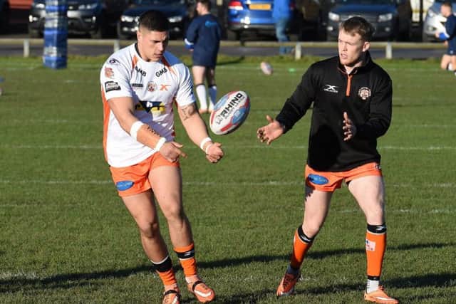 Tigers forward Mitch Clark, left, and Cory Aston