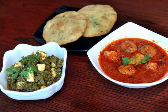 310118   Starters  of Bhaji Peneer : Spinach (Bhaji) Paneer (Indian Cheese) curry (left) with   Bhagat Muthiya  :  Chickpea Koftas (Muthiya) and potatoes made into a lightly spiced curry  at Hansas restaurant on North Street in Leeds   YP Mag.