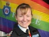Chief Constable Dee Collins raises one of the rainbow flags being flown outside West Yorkshire Police stations this month.