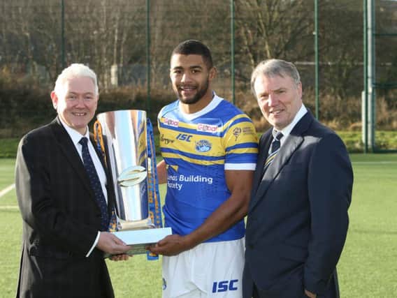 WINNING TEAM: Leeds Building Society chief executive officer Peter Hill with Super League trophy, Rhinos new team captain Kallum Watkins and chief executive Gary Hetherington.