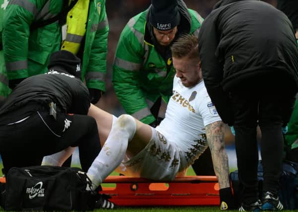 WORRYING: Leeds United centre-back Pontus Jansson is stretchered off. Picture by Bruce Rollinson.