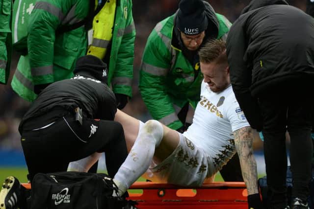 Injured centre-back, Pontus Jansson is helped on to a stretcher at Elland Road. PIC: Bruce Rollinson