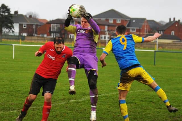 Hampsthwaite goalkeeper Curtis Nelson collects under pressure at Swillington Saints. PIC: Steve Riding