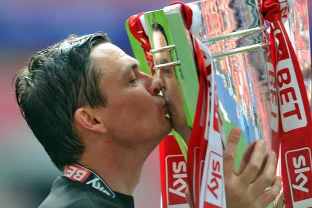 Paul Heckingbottom, who has been appointed as Leeds United's new head coach, celebrates promotion from League One with Barnsley in 2016.