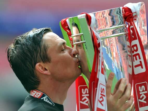Paul Heckingbottom, who has been appointed as Leeds United's new head coach, celebrates promotion from League One with Barnsley in 2016.