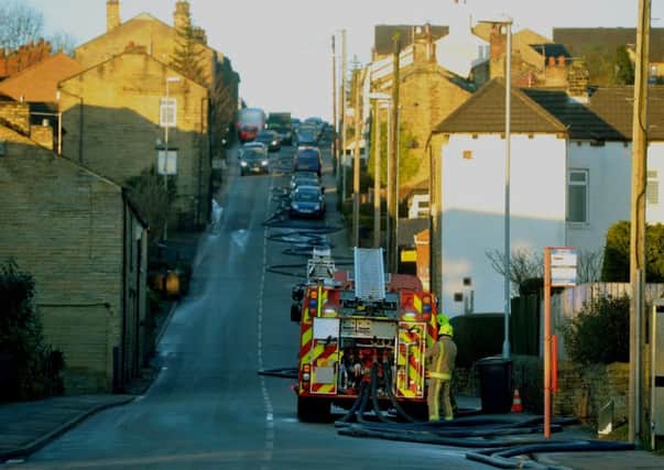 Fire engines pump water from the centre of Pudsey to the scene of the fire on Kent Road. Picture: Tony Johnson.