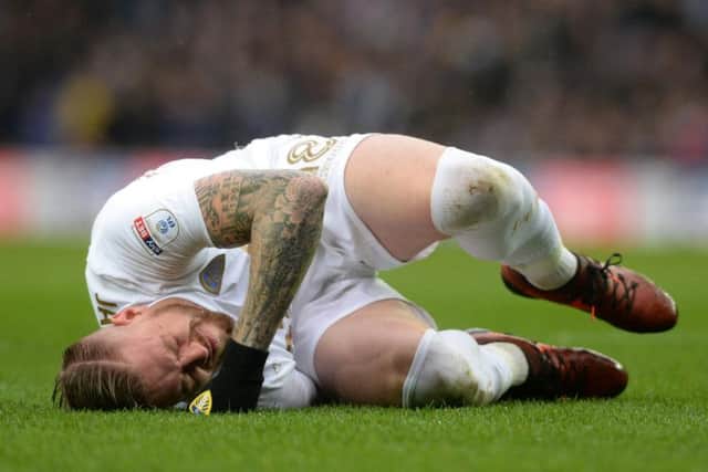 Pontus Jansson goes down after a collision with Cardiff defender Sol Bamba.