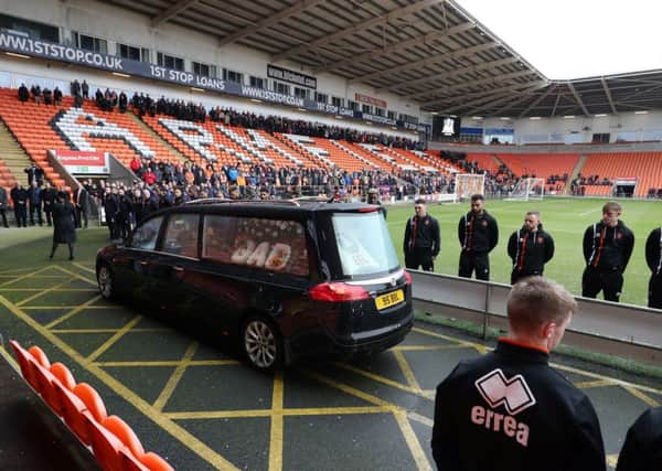 Blackpool players line up as the funeral cortege for Jimmy Armfield passes through Bloomfield Road. PIC: PA