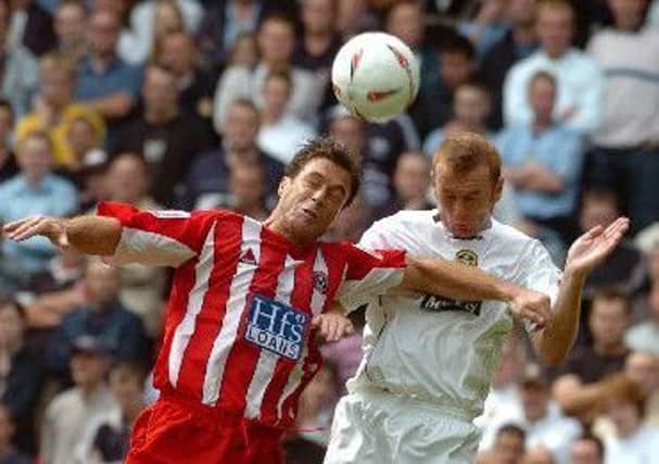 AERIAL BATTLE: Leeds' Stephen Crainey battles with Sheffield United's Ashley Ward during a Bramall Lane clash back in August 2004, the Blades striker scoring in a 2-0 win. Picture: Tony Johnson.