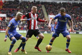 Ezgjan Alioski and Adam Forshaw of Leeds United tackle Mark Duffy. PIC: Simon Bellis/Sportimage