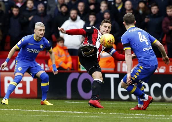 Billy Sharp scores Sheffield United's first goal against Leeds United on Saturday.