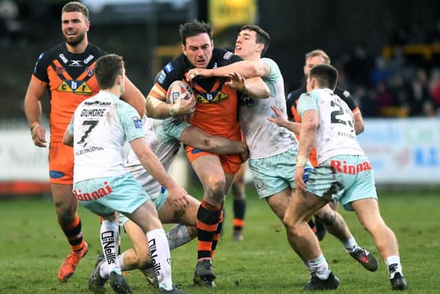 Castleford's Grant Millington charges into the Widnes defence. PIC: Jonathan Gawthorpe