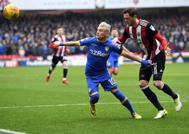Ezgjan Alioski takes on Sheffield United's Richard Stearman.
 PIC: Jonathan Gawthorpe