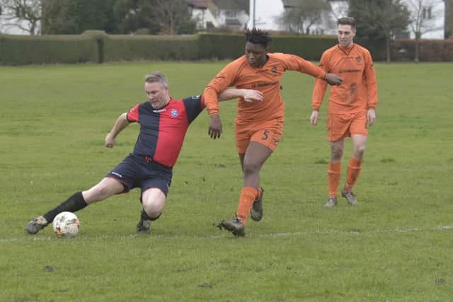 Lee Kaye, of Old Batelians Reserves, takes on Shire III's Gift  Mhlanga during Saturday's Hodgson Cup. PIC: Steve Riding