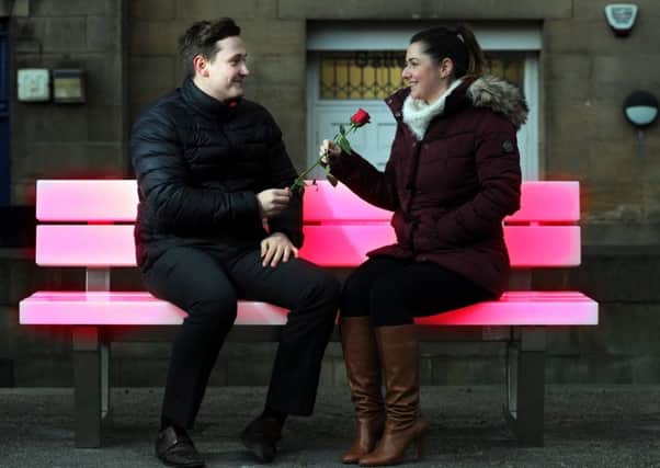 LOVE LIGHTS: Leeds BIDs Jane Coughlin and Joe Lawson try out one of the light benches installed in Victoria Gardens.