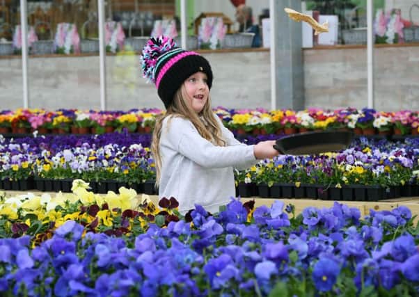 FUN: Edith Graham, five, flipping a pancake at Leeds Parks Nurserys Shrove Tuesday celebrations.