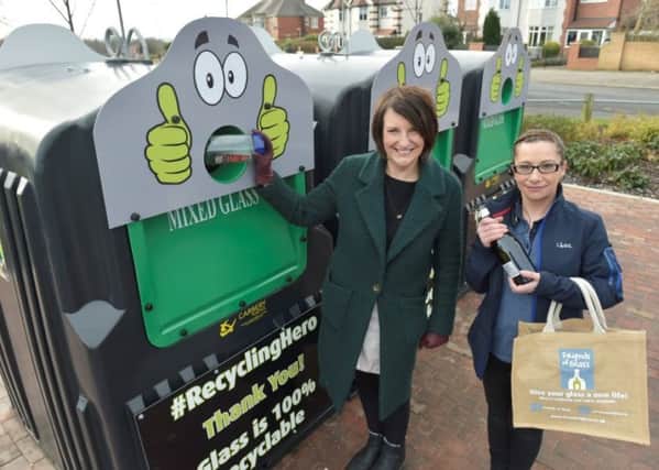 RECYCLE: Coun Lucinda Yeadon, left, and Emma Thompson, duty manager of Lidl in Halton, at the bottle bank.