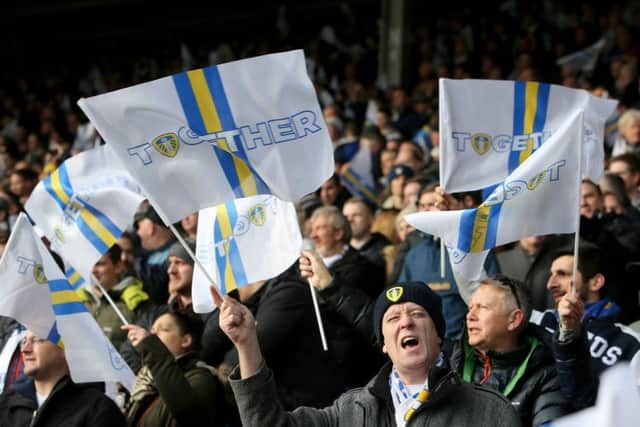 Flag-waving Leeds United fans 'marching on together'. PIC: Richard Sellers/PA Wire