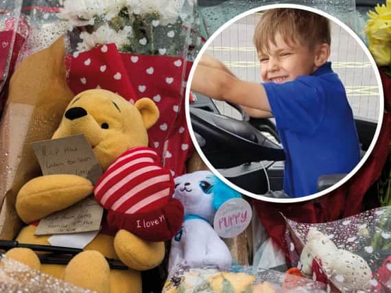 A growing number of floral tributes have been left at the scene of the fire which claimed Alex Clarke's life.