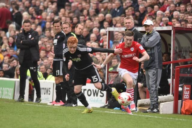 HIGH PRAISE: From Bristol City's Liverpool loanee Ryan Kent, right, pictured in action for Barnsley under the watchful eye of former Tykes boss Paul Heckingbottom, far left.