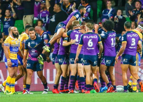 Melbourne Storm celebrate scoring in the World Club Challenge.